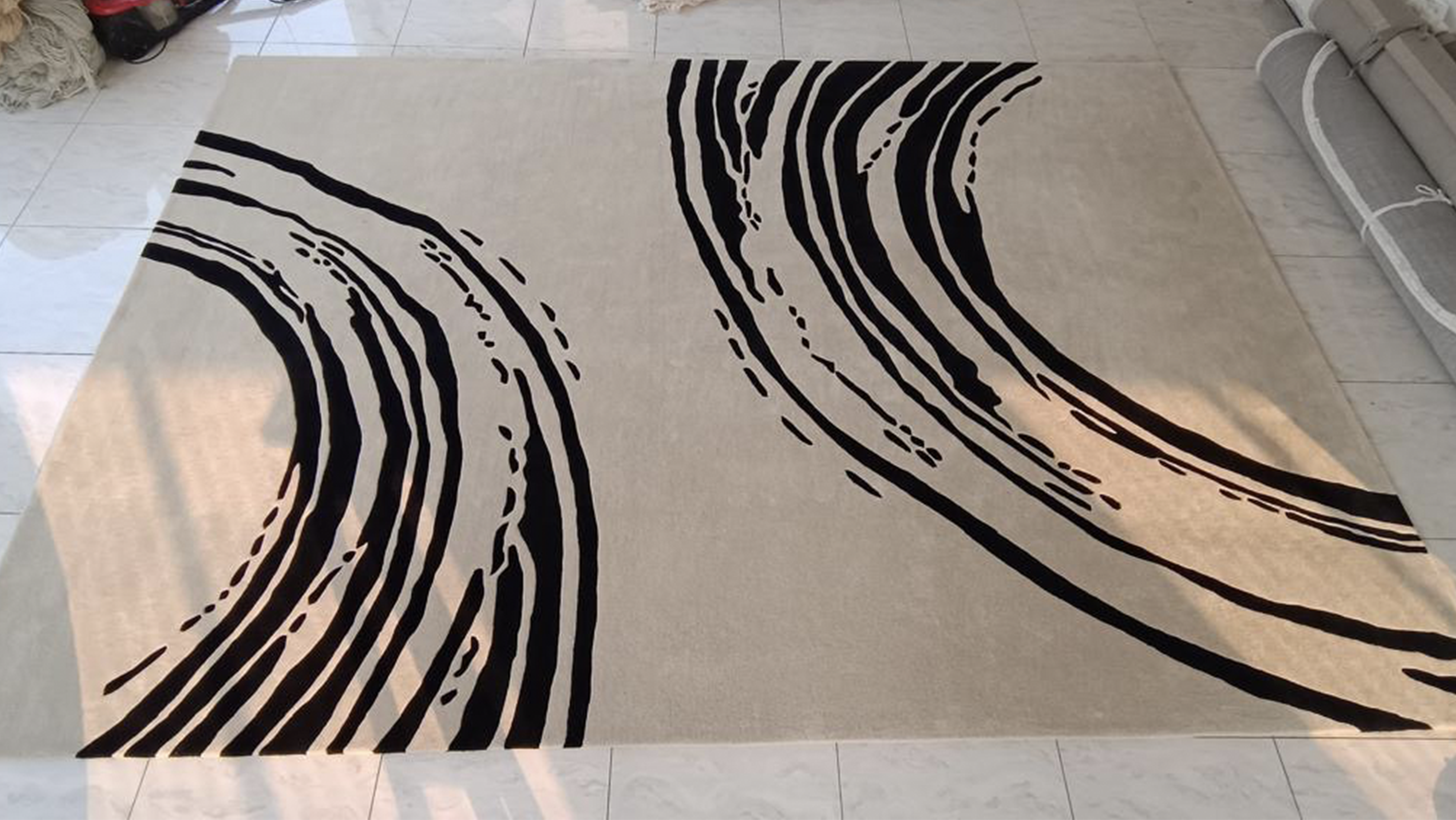 Large modern custom rug with bold black wave shapes