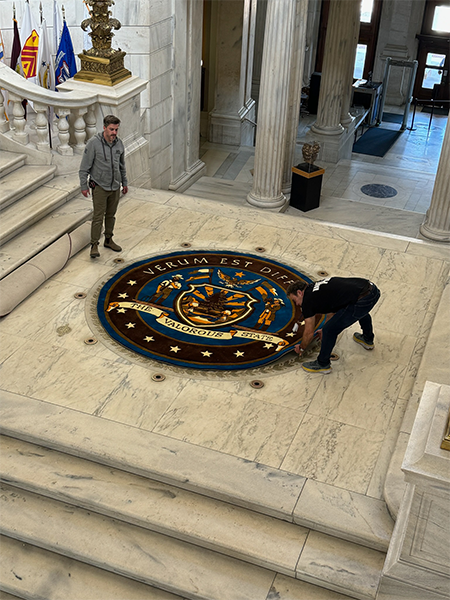Large custom seal rug installed inside a government building