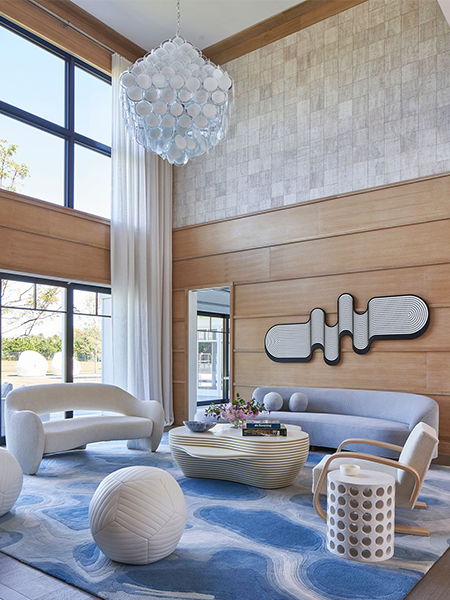 Modern living room with a large custom area rug installed