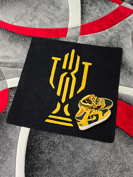 Custom logo rug photographed with matching footwear for branding