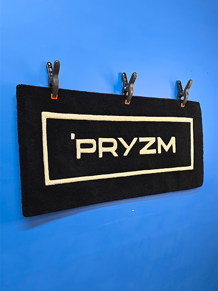 Custom wordmark logo rug designed for a modern brand