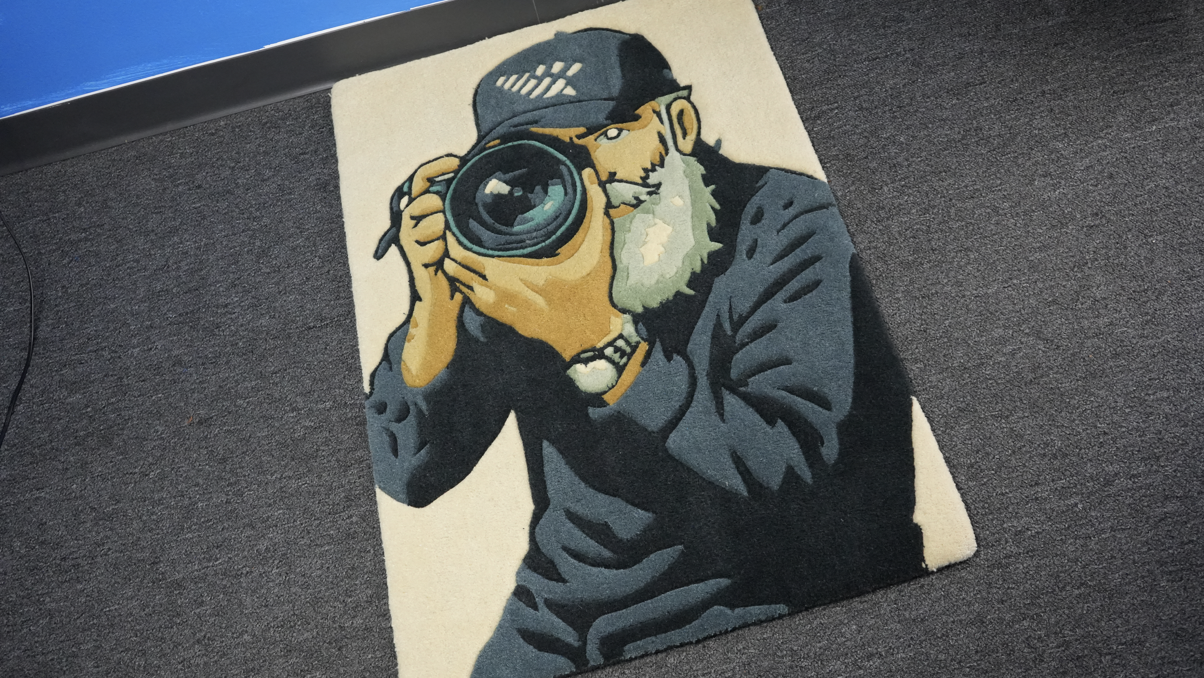 Custom portrait rug featuring a photographer illustration