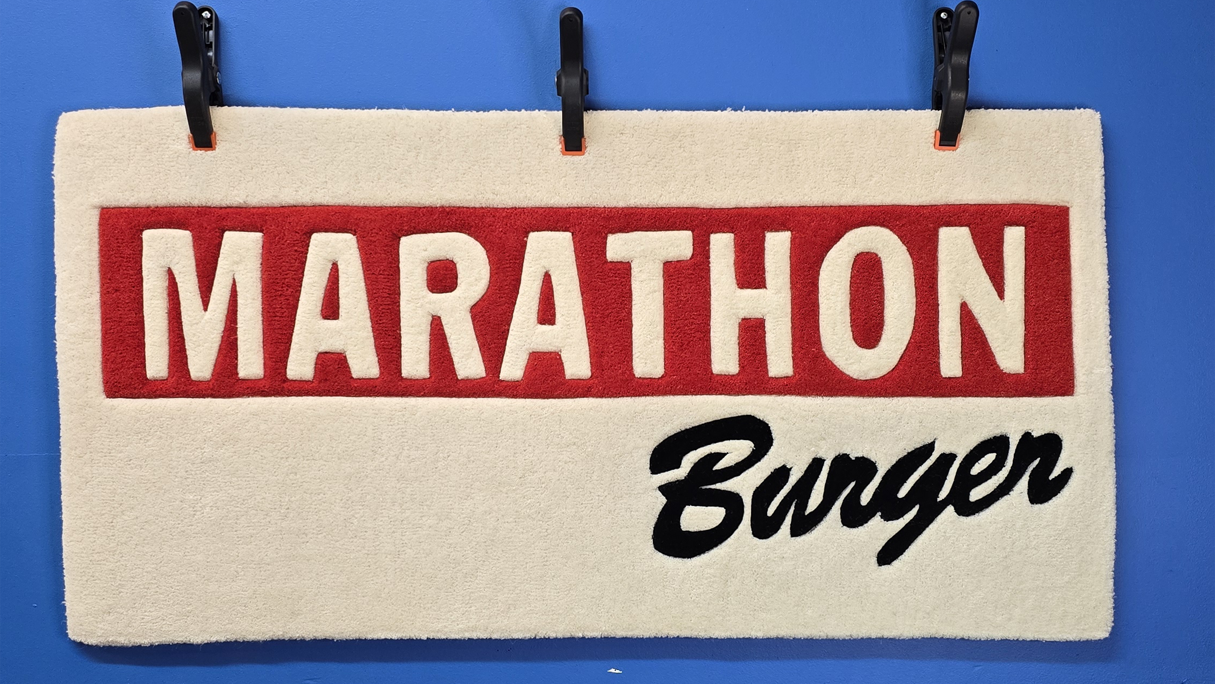 Custom logo rug created for a restaurant brand