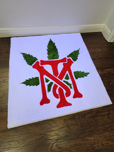 Custom monogram rug with decorative leaf accents